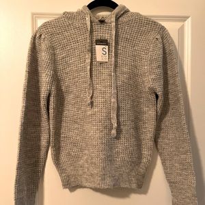 Light grey sweater hoodie.